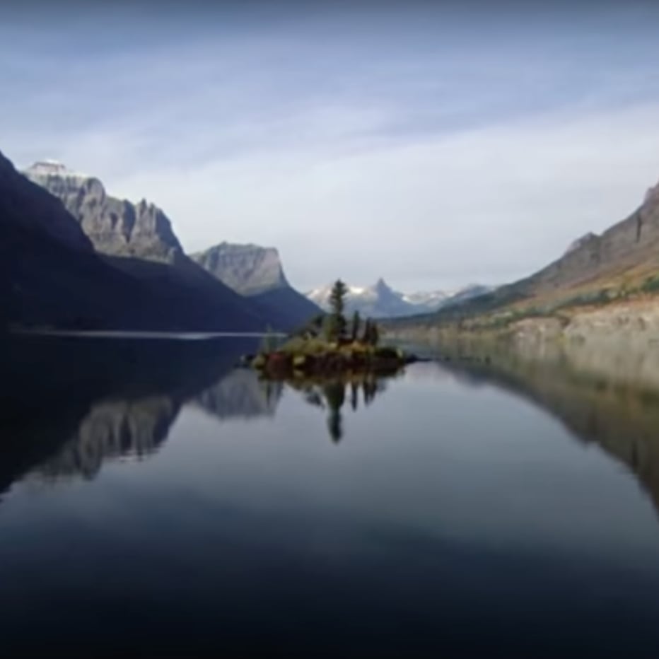 Opening shot of The Shining — symmetric wide view of St. Mary Lake and Wild Goose Island